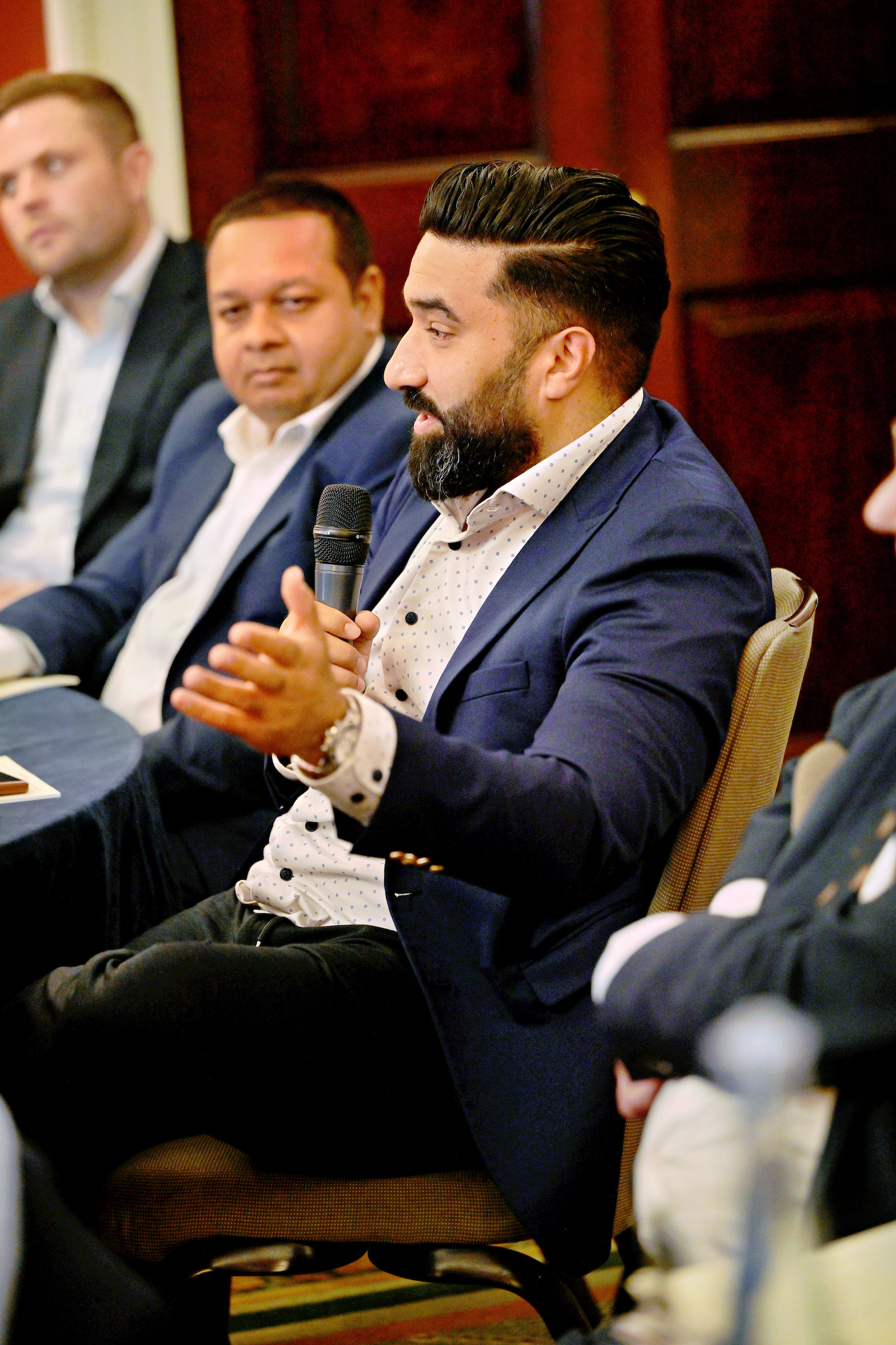 Hussnan speaking at a panel discussion